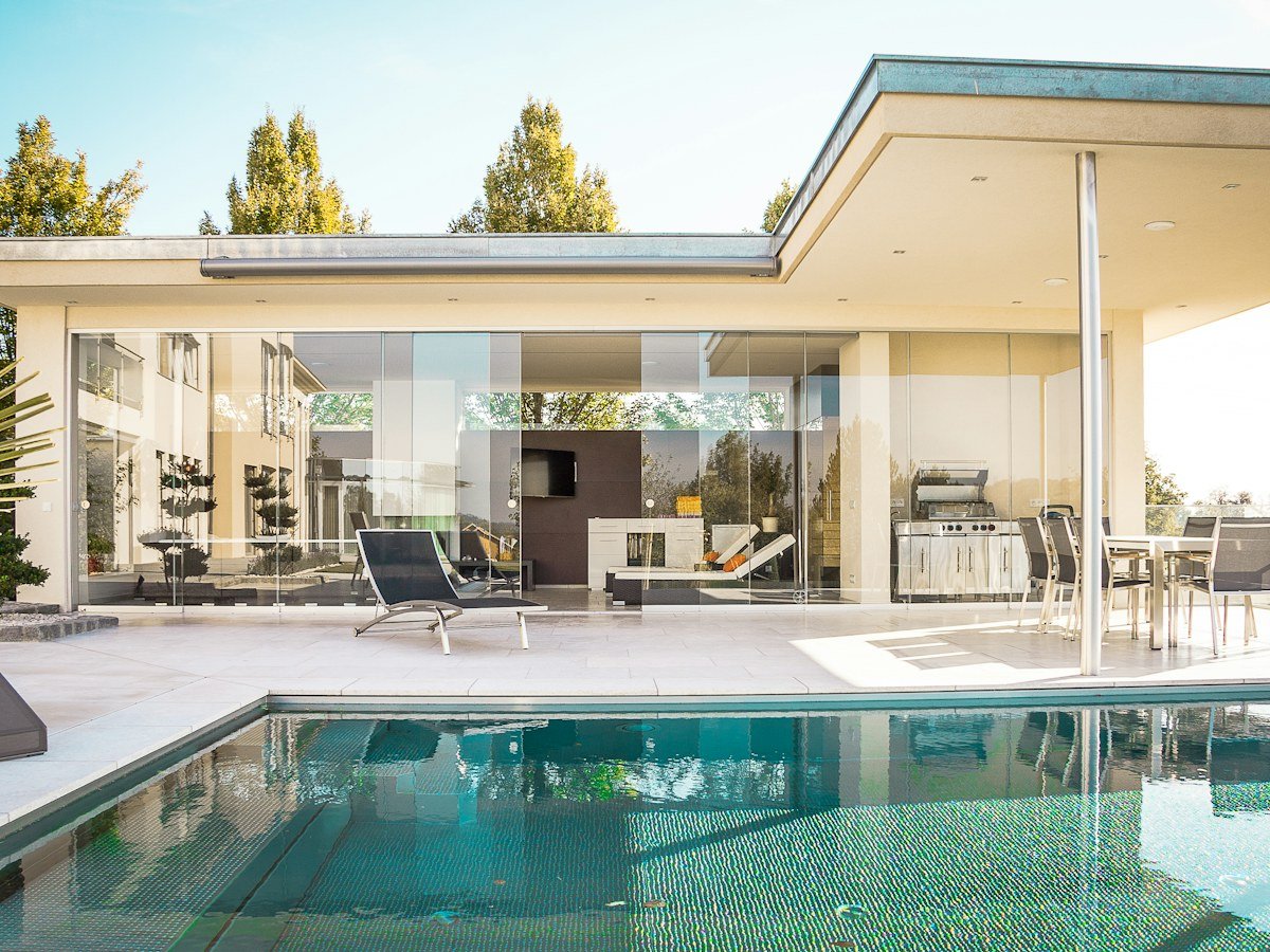 Bright modern luxury villa with infinity pool and white terrace